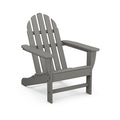 Gray POLYWOOD Classic Adirondack Chair with wide armrests and slatted backrest, made from durable lumber, viewed from the front right angle.