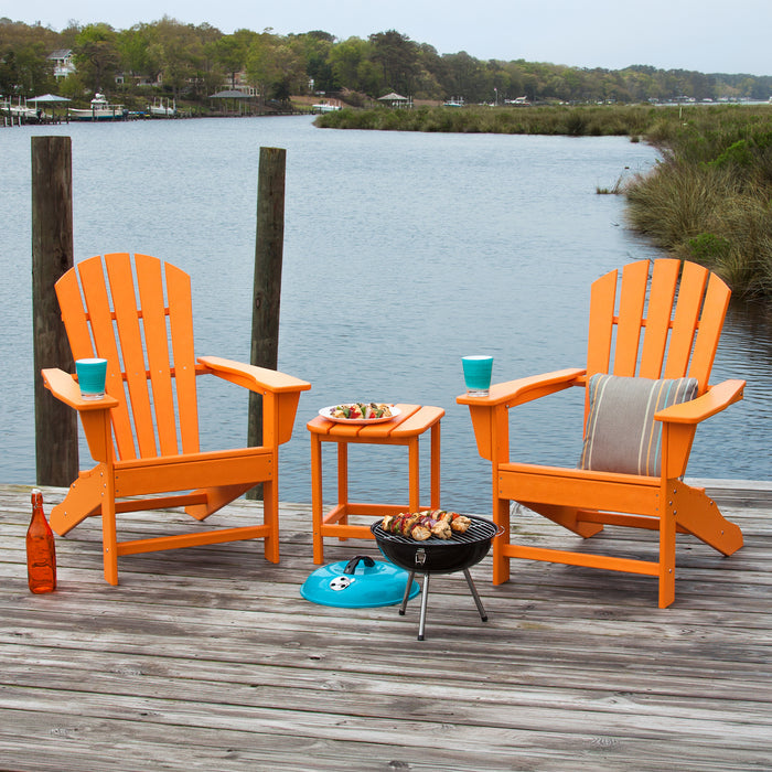 Two POLYWOOD Palm Coast Adirondack Chairs and a matching table showcased outdoors, highlighting the quality craftsmanship and design of the furniture.