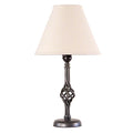 Hubbardton Forge Small Twist Basket Table Lamp with a twisted dark metal base and beige shade, showcasing elegant handcrafted American design.